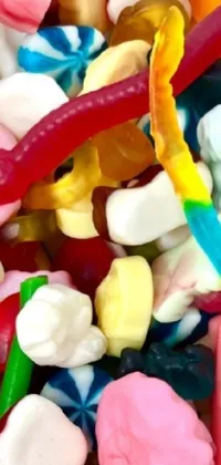 Brighten up your phone with this delicious live wallpaper featuring a colorful and vibrant pile of assorted candy