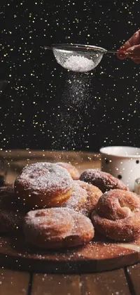 Satisfy your sweet cravings with this phone live wallpaper featuring delectable doughnuts covered in powdered sugar