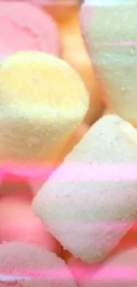 Enjoy a charming live wallpaper featuring a pile of marshmallows ready to be roasted on a bonfire