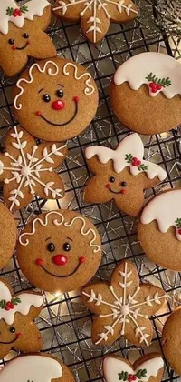 This live phone wallpaper showcases a rustic cookie rack adorned with gingerbread people and candy canes