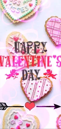 The delightful phone live wallpaper features an elegant white table adorned with beautifully crafted cookies in various shapes such as hearts and stars, decorated with vibrant icing