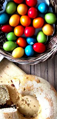 Decorate your phone with this Easter-inspired live wallpaper featuring a delectable loaf of bread and a vibrant Easter basket filled with colorful eggs
