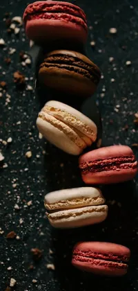 This exquisite phone live wallpaper showcases a row of macarons in a stunning macro photograph