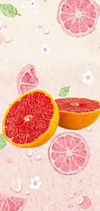 This grapefruit live wallpaper showcases a succulent grapefruit divided in two on a vibrant pink background