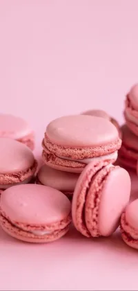 Bring a touch of sweetness to your phone screen with this beautiful live wallpaper featuring a pile of pink macarons