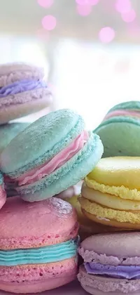 This phone live wallpaper showcases a white plate covered in a colorful array of macarons