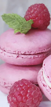 Indulge in the delectable sight of raspberry macarons stacked in this live wallpaper