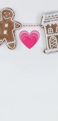 This adorable phone live wallpaper displays a string of gingerbread cookies as the main image