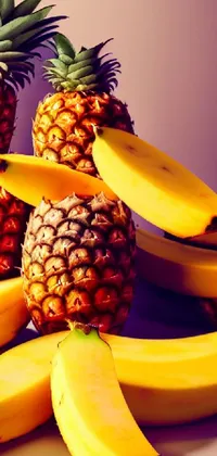 This striking phone live wallpaper depicts a colorful pile of ripe bananas and juicy pineapples, rendered with digital art techniques