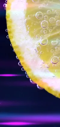 If you're in search of a refreshing and unique live wallpaper for your phone, this stunning macro photograph of two slices of lemon is a perfect choice
