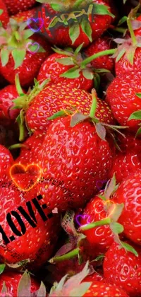 This dynamic phone live wallpaper features a stunning close-up shot of fresh strawberries, showcasing their vibrant red hue and luscious texture