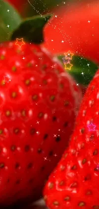 This live wallpaper features two luscious strawberries sitting on a wooden table