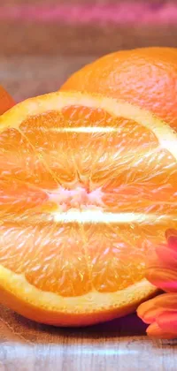 This live wallpaper showcases a realistic image of oranges on a wooden table, in vivid 4K resolution
