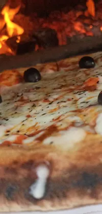 This mobile live wallpaper features a wood-fired, Sicilian-style pizza resting on a white plate with black spots