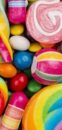 This live phone wallpaper features a colorful pile of candies and lollipops arranged in a playful and cheerful manner