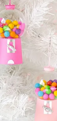 This Candy Dispenser Christmas Tree Live Wallpaper is perfect for anyone who loves vibrant and playful phone backgrounds