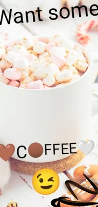 This stunning phone live wallpaper depicts a close-up of a warm coffee cup, complete with fluffy marshmallows