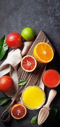 Transform your phone into a bright and refreshing oasis with this Live Wallpaper of a wooden cutting board adorned with oranges and limes