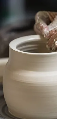 This phone live wallpaper features a potter's wheel process inspired by still-life art