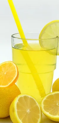 Looking for a stunning live wallpaper for your phone? This mesmerizing artwork features a delicious glass of lemonade with a straw and real lemons on the ground
