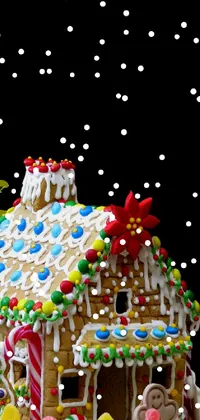 This live wallpaper for your phone is a digital rendering of a gingerbread house in a snowy winter landscape