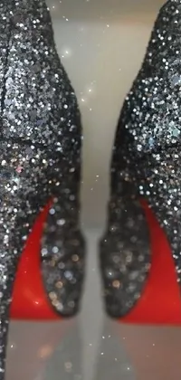 This amazing phone live wallpaper depicts silver and red pointillism designed high-heeled shoes embellished with dazzling diamonds and a background photo perfect for a night out