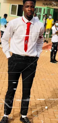 This phone live wallpaper features a dapper man standing in front of a building, sporting a vibrant red tie and a school uniform emblazoned with the letters "JK