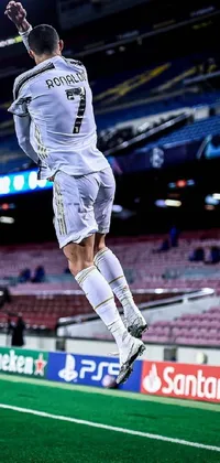 This <a href="/">phone live wallpaper</a> features a dynamic image of a man jumping to catch a soccer ball