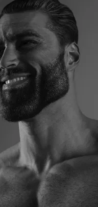 Get this stunning black and white live wallpaper and enhance your mobile device's look! Featuring a fine art mid-shot of a smiling, bearded man, this high-quality render captures the subject's muscular neck and shoulders, perfectly