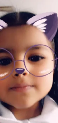 This phone live wallpaper displays a close-up of a child wearing glasses, captured through colorized digital art