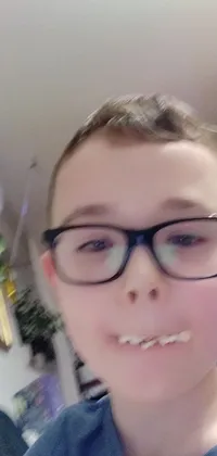 Introducing a unique phone live wallpaper featuring a close up view of glasses on a person's face in an indoor setting