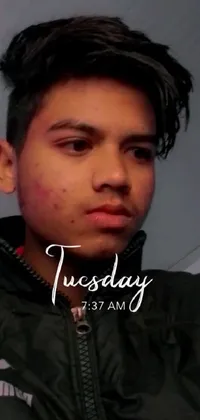 This phone live wallpaper features a stunning close-up shot of a person wearing a jacket in daylight