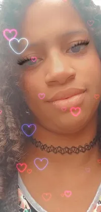This live wallpaper features a close-up of a person wearing a choker with a vibrant heart painted on her face