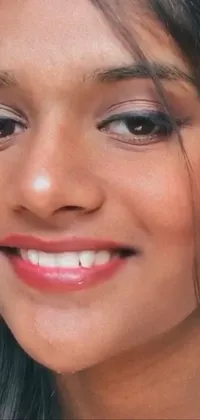 This stunning live phone wallpaper features a hyperrealistic, ultrarealistic UHD faces close-up of a smiling Indian woman with brown skin