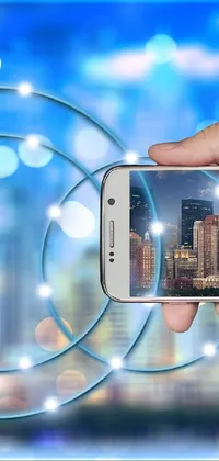 This dynamic live wallpaper features a smart phone held against an impressive city skyline