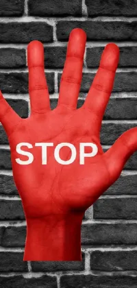 Get sizzling with the "Stop Hand" live wallpaper for your phone! This red graffiti-style hand with the word "stop" in bold caps stands out against an edgy brick wall backdrop
