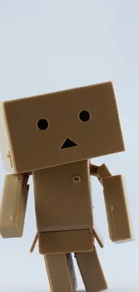 Looking for a unique and fun wallpaper for your phone? Look no further than this cardboard robot design! The robot is made entirely out of cardboard and screws, giving it a cool sci-fi look that will make your phone stand out