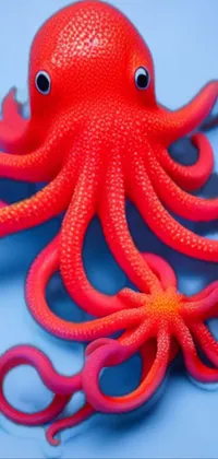 Get mesmerized by this stunning phone live wallpaper featuring a realistic 3D rendering of a toy octopus in striking red color
