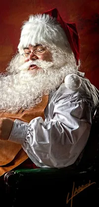 Presenting a festive phone live wallpaper with a realistic portrait of Santa Claus engulfed in a classic, stylized fine art image, perfect for the holiday season