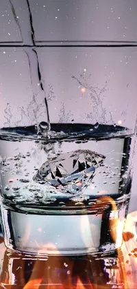 Check out this stunning live wallpaper featuring a photorealistic glass of water filled with sparkling stardust