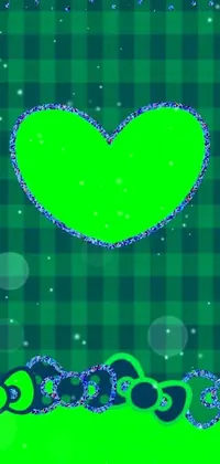 This digital art live wallpaper features a green heart symbol, set against a blue and green checkered background with a delightful glitter effect