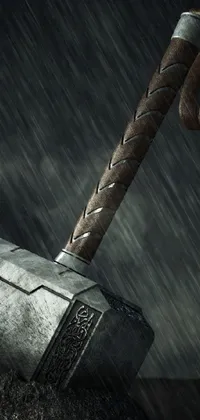 This live phone wallpaper showcases a mesmerizing image of the Norse deity, Thor, standing proud with his iconic hammer weapon