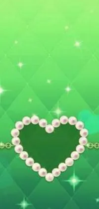 This live wallpaper showcases a stunning heart made out of pearls on a beautiful background of green hue