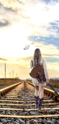 This stunning phone live wallpaper showcases a beautiful digital art image of a woman playing guitar on a train track