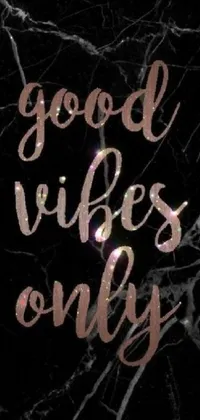 This phone live wallpaper boasts a chic marble wall texture with the phrase "good vibes only" inscribed in elegant script