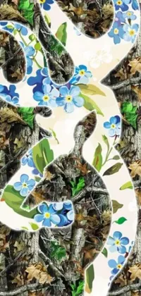 This dynamic phone live wallpaper features a realistic painting of a snake adorned in blue flowers as it blends into its forest surroundings
