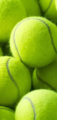 Looking for a playful and dynamic live wallpaper for your phone? Look no further than this tennis ball pile! This wallpaper features a vibrant green pile of tennis balls stacked together in a fun and eye-catching way