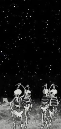 This stunning phone live wallpaper features a unique and captivating design - a pair of intertwined skeletons standing peacefully on a grassy field against the backdrop of a starry night sky in black and white