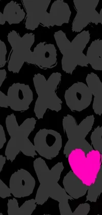 This live phone wallpaper features a vibrant pink heart over a black background with a graffiti or X logo design on grey