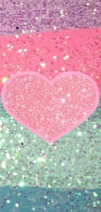 This stunning phone live wallpaper showcases a heart close-up on a glittery green and pink background